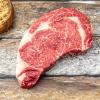 Boneless Rib-Eye on wooden background