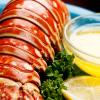 Lobster tail served with clarified butter and a slice of lemon