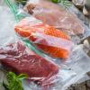 Beef, salmon and chicken in zipper-closure plastic bags, prepared for sous vide cooking